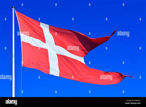 The National Flag Of Denmark Dannebrog Flying High Over Copenhagen