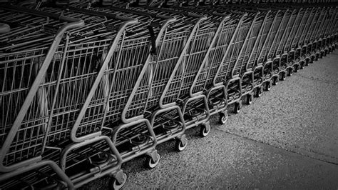 Premium Photo Shopping Carts Arranged Outside Store