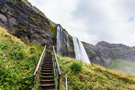 steps to cave in Seljalandsfoss waterfall 12483002 Stock Photo at Vecteezy