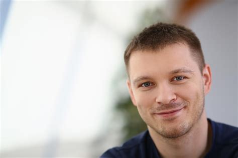 Premium Photo Portrait Of Handsome Smiling Young Man With Stubble