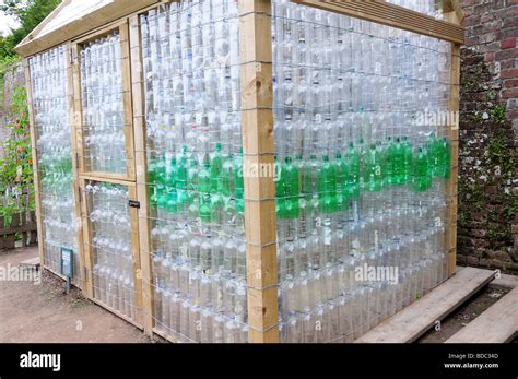 Garden Shed Greenhouse In Wood And Recycled Plastic Bottles Stock Photo