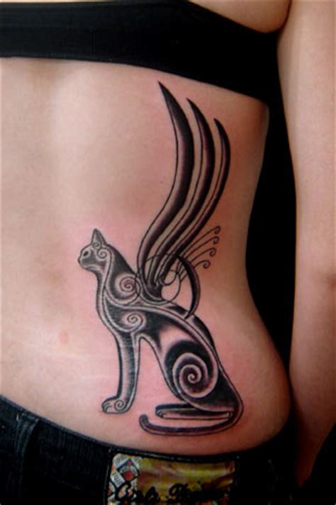 Egyptian style tracery cat with wings tattoo - Tattooimages.biz