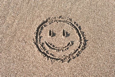 Smiley Face Drawn On Beach Sand Stock Photo Image Of Impression