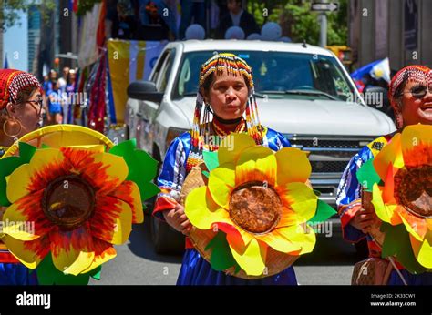 The Participants In Traditional Filipino Outfits Marching In The