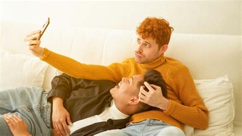 Premium Photo Happy Gay Couple Taking A Selfie Together In The Sofa