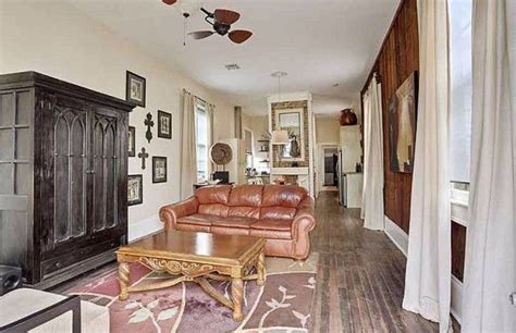 A Living Room Filled With Furniture And A Fire Place