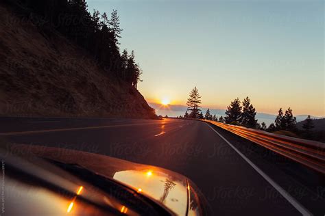 "Highway Driving At Sunset" by Stocksy Contributor "VISUALSPECTRUM" - Stocksy