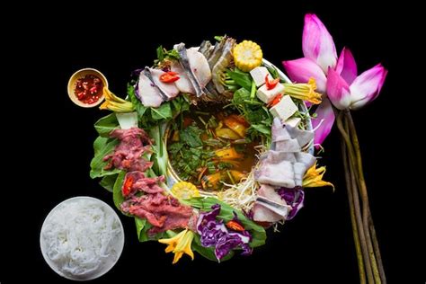 Premium Photo Vietnamese Hot Pot With Raw Seafood On Black Background