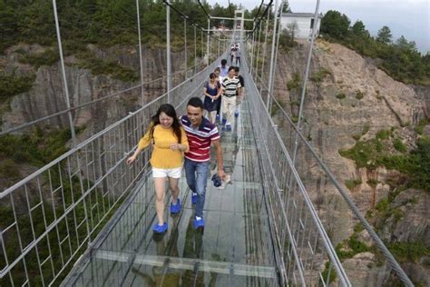 High Altitude Suspension Bridge Made Of Glass Opens In Hunan China