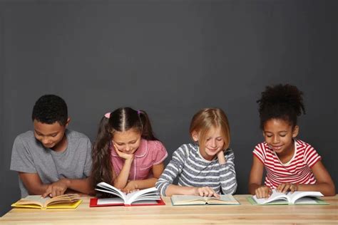 Cute Kids Reading Books Stock Photo By ©belchonock 120332890