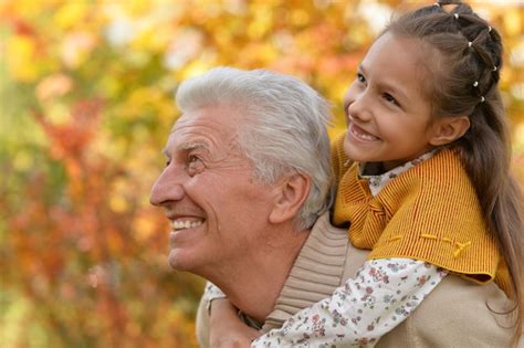 Premium Photo Portrait Of Happy Grandfather And Granddaughter Having