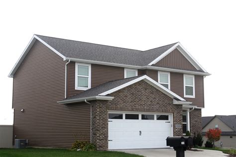 Driftwood Roof White Trim White Carriage Style Garage Door Royal