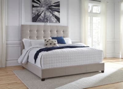 Ashley Queen Upholstered Bed | Homemakers