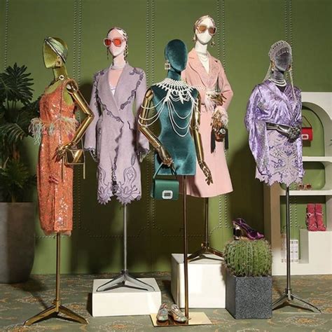 Three Mannequins Dressed In Pastel Colored Clothing