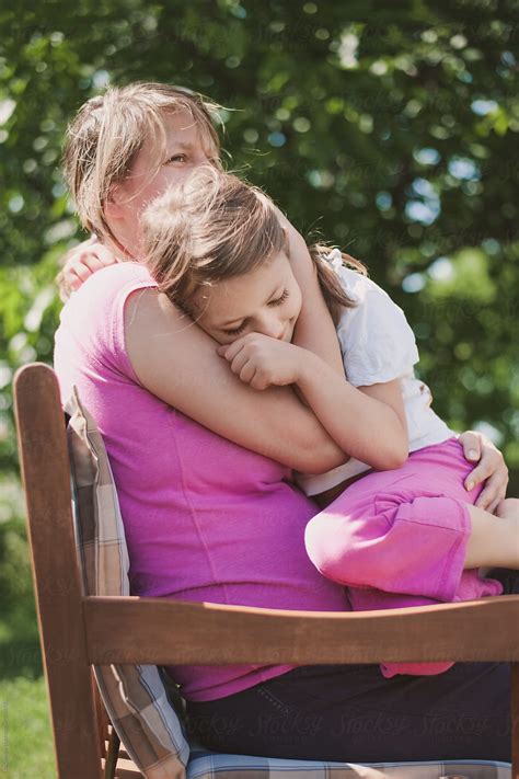 Portrait Of A Mother And Daughter Hugging Each Other By Stocksy