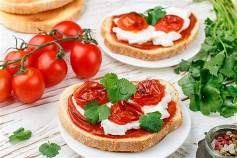 Fresh Homemade Crispy Bruschetta With Baked Tomatoes Cherry Cream