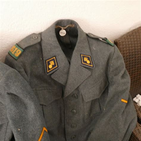 3 Swiss Military Uniforms, jackets and trousers with emblems - Catawiki