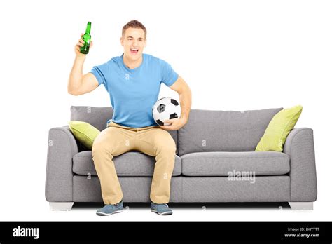 Happy Cheerful Male Sport Fan With Football And Beer Watching Sport