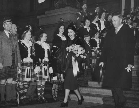 A Group Of People Standing Around Each Other Photo Free Historical