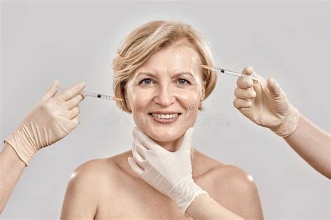 Portrait Of Beautiful Naked Middle Aged Woman Smiling At Camera While