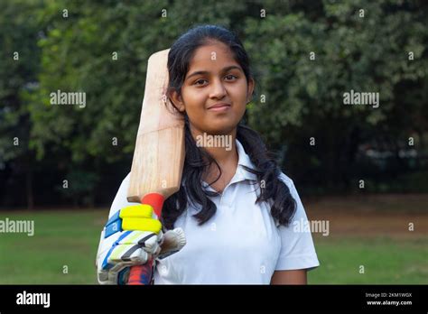 Portrait Of A Female Cricketer Holding A Cricket Bat Stock Photo Alamy