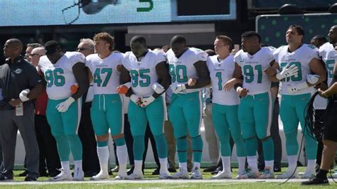 Miami Dolphins players kneel, link arms during national anthem | Miami ...