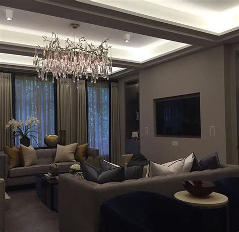 A Living Room Filled With Furniture And A Chandelier