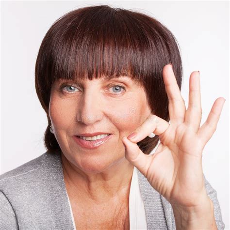 Mature Woman Studio Shot Stock Photo Image Of Contemporary