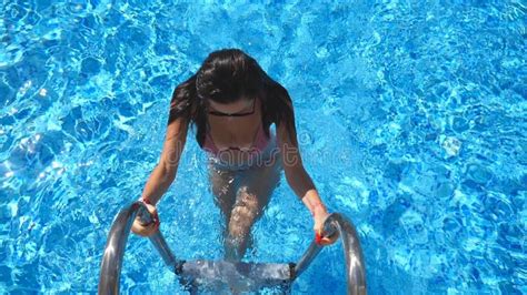 Attractive Woman In Pink Bikini Getting Out Of Pool Young Girl