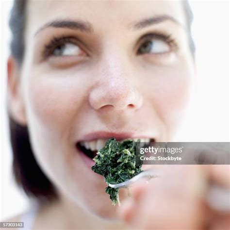 Woman Eating Spinach Photos And Premium High Res Pictures Getty Images