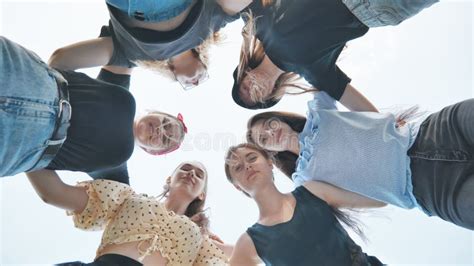 Happy Girls Friends Hugging In A Circle On A Green Background Teamwork Concept Stock Footage