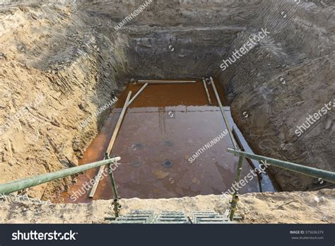 sump pit underground work excavation soil stock photo