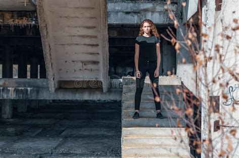 Cute Teenage Girl With Curly Hair Standing On The Stairs Abandoned Building Unfinished