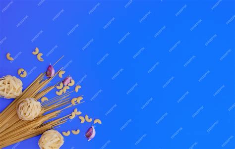 Premium Photo Spaghetti Tagliatelle Pasta On Blue Background