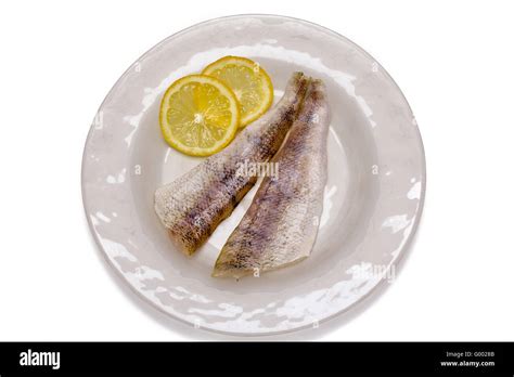 Raw Fish Filets With Lemon Stock Photo Alamy