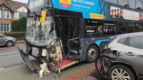 Two People Injured After Double Decker Bus Crashes Into Four Parked