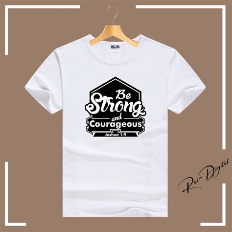 Be Strong And Courageous Bible Verse Graphic Tee Shirt Design For Men And