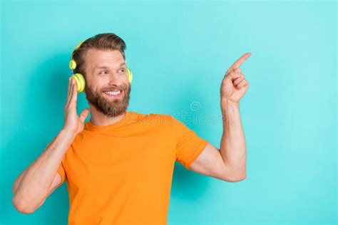 Portrait Of Good Mood Guy With Blond Hairdo Wear Orange T Shirt Fingers