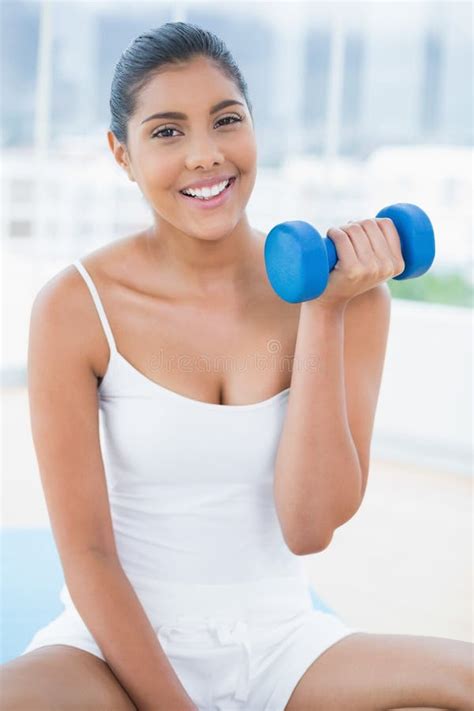 Smiling Toned Brunette Working Out With Dumbbells Stock Photo Image