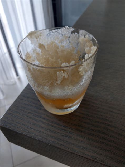 This Frozen Glass Of Whiskey In Which The Alcohol And Water Have Been Separated Forming Flakes