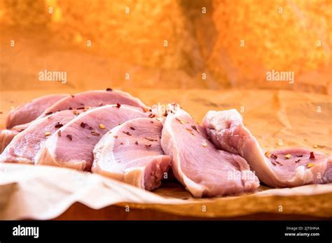 Fresh Raw Pork Chops On A Cutting Board Arrangement On The Wrapping