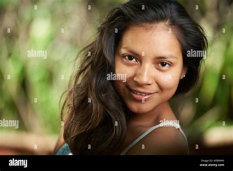 Smiling Brunette Woman Close Up Portrait On Natural Blurred Background Stock Photo Alamy