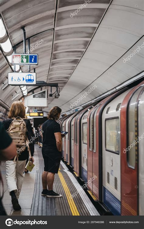 People On A London Underground Station Platform Train Passing B Stock Editorial Photo