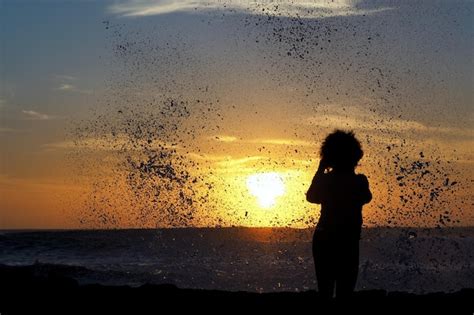 Premium Photo Silhouette Woman Against Splashing Water During Sunset