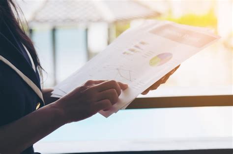 Premium Photo Midsection Of Woman Holding Paper