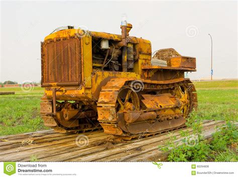 An Antique Tractor On Tracks At An Agricultural Museum In Saskatchewan