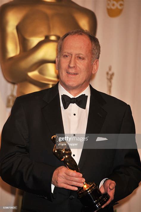 Us Cinematographer Robert Elswit Holds His Oscar For Achievement In