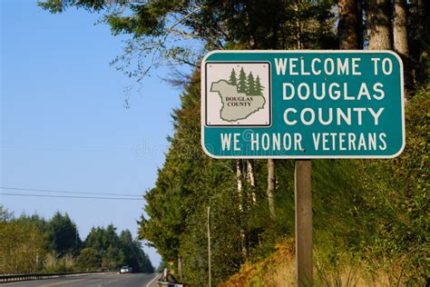 Welcome To Douglas County Sign Backdrop Of Highway 101 Stock Photo