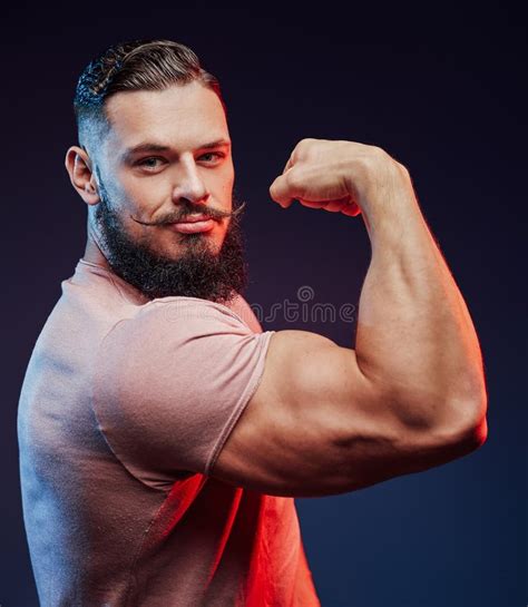 Fashionable Muscular Athlete With Beard Posing In Studio Stock Photo