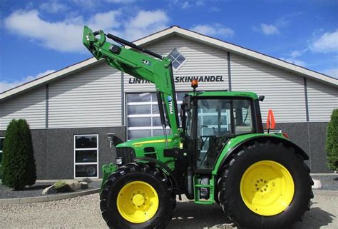 John Deere 6230 med frontlift og Trima 4 0P frontlæsser Traktor in